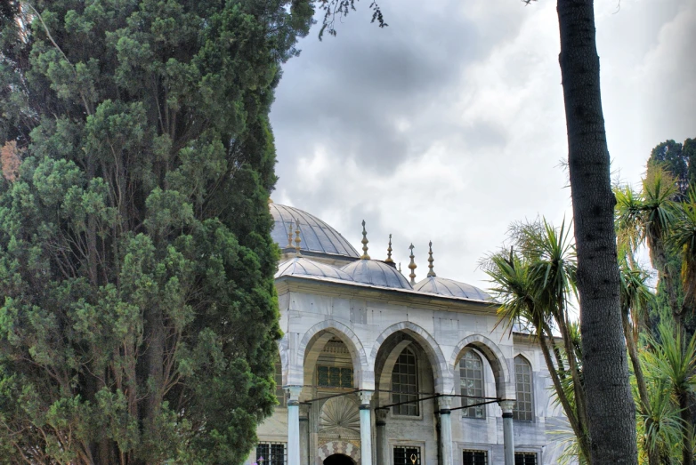 this is a beautiful white building with a dome on top