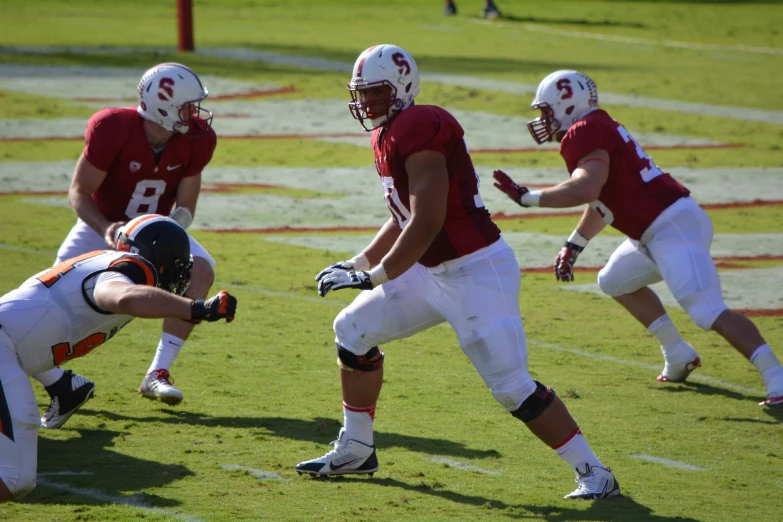 a football team holding onto another team during a game