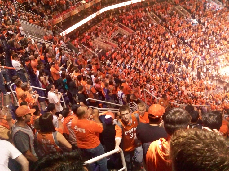 the stadium is full of fans during an orange game