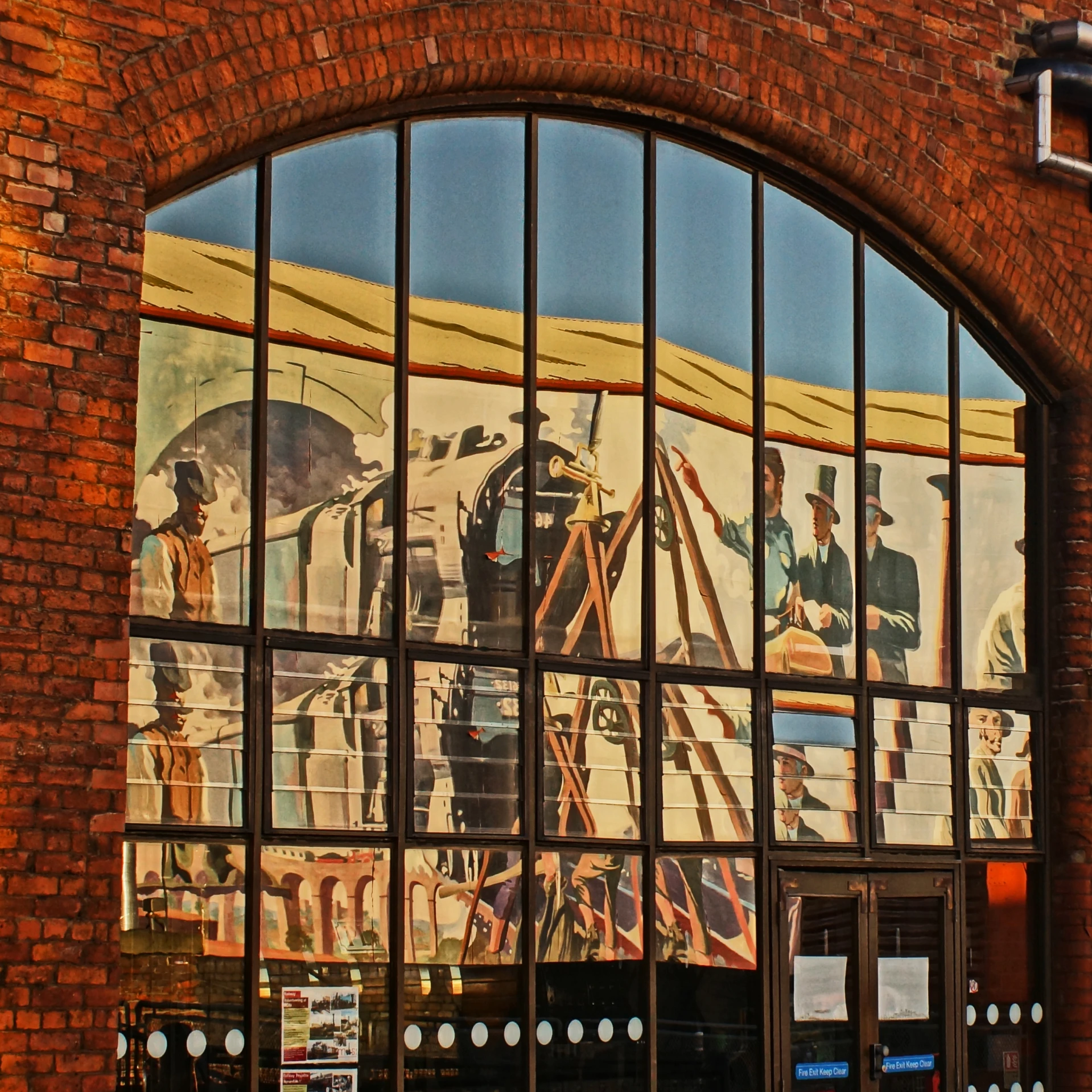 an image of an old train on display through a window