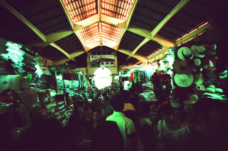 an asian market with people shopping at night