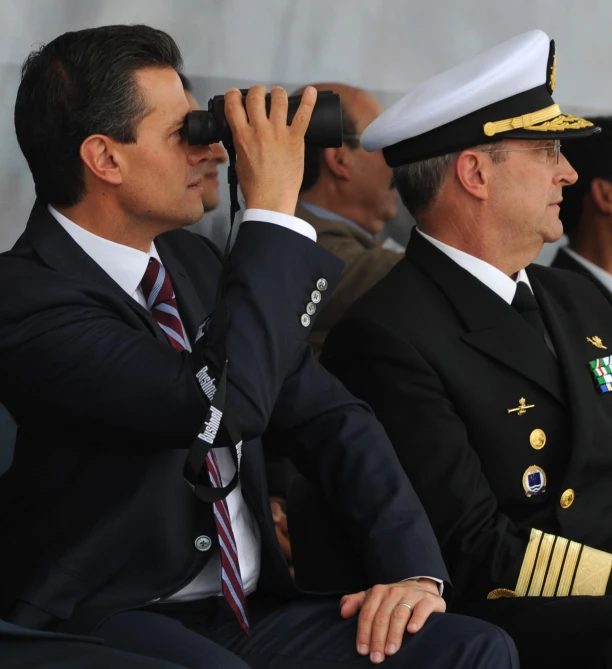 several soldiers sitting together at a military event