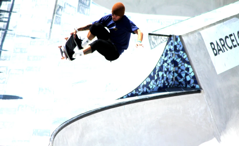 man performing trick on skate board at a skating competition