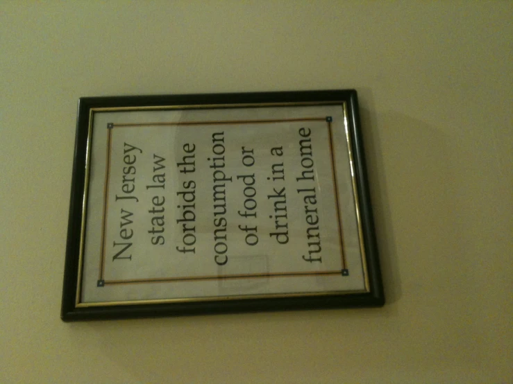 a framed picture hanging on the wall of a restaurant