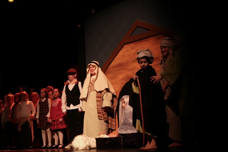 some people dressed in medieval costumes and standing on stage