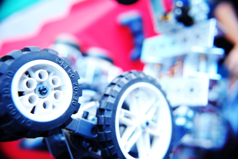 closeup of a toy truck wheels with another wheel attached