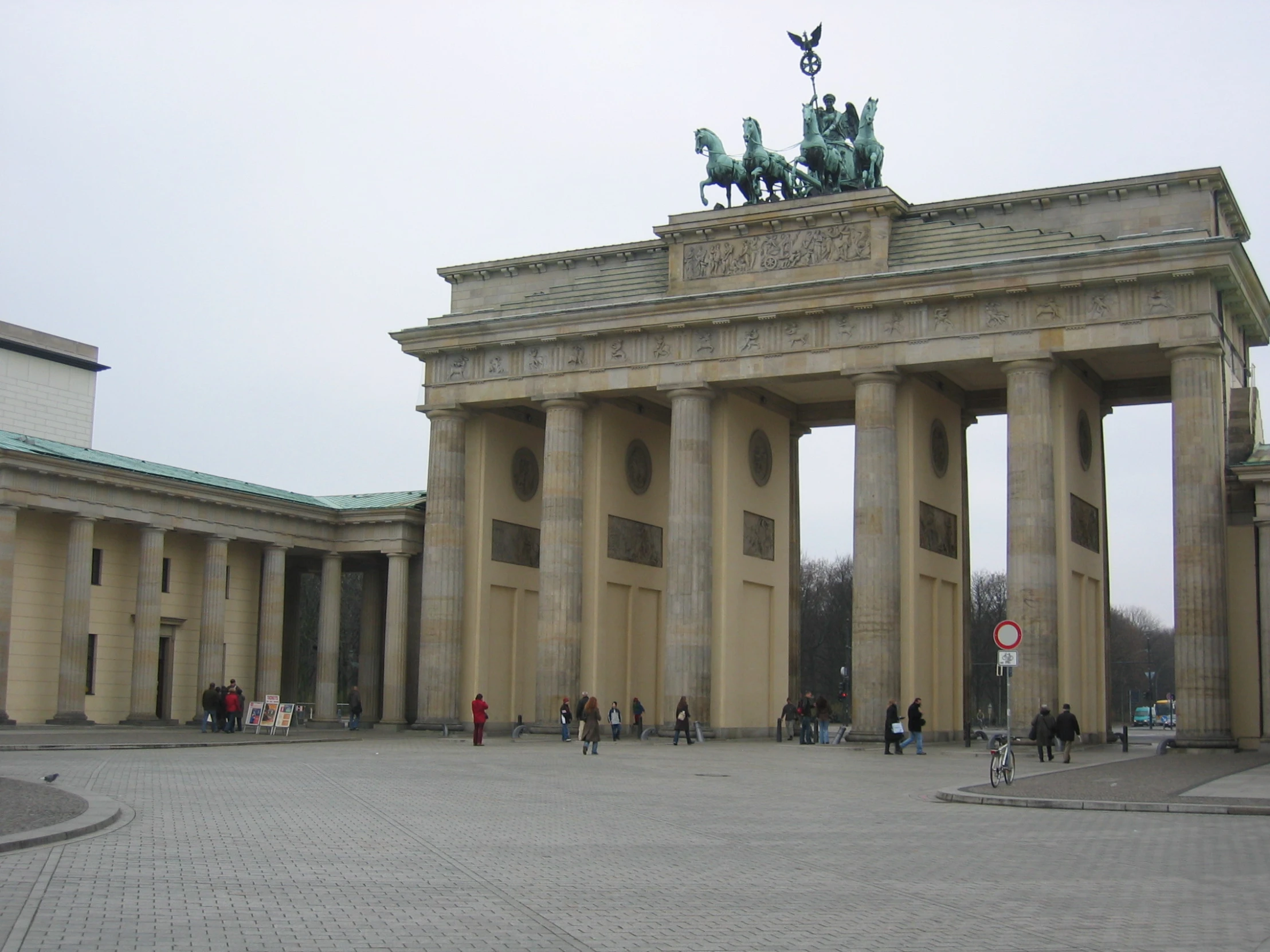 a group of people gathered around an arch