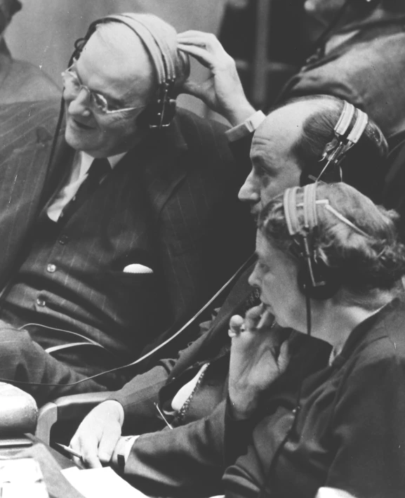 two old time women on cell phones at a meeting