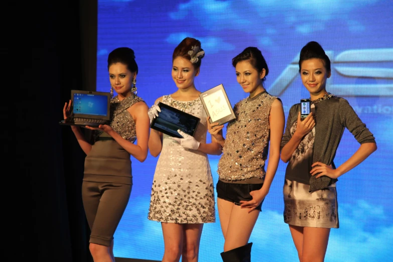 the models are displaying their items on display