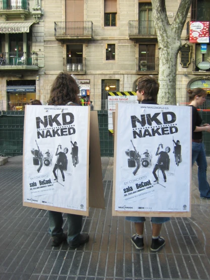 two men are holding signs that say  