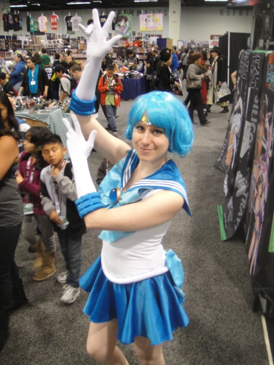 a person in a convention holding a hand sign