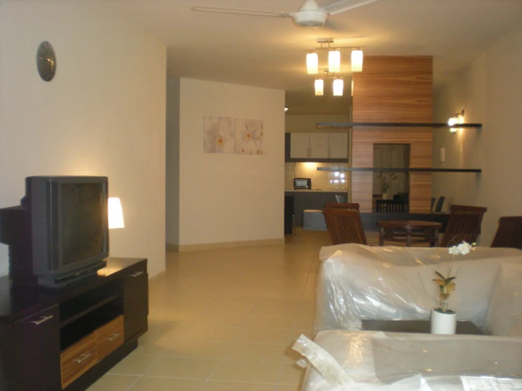 a living room filled with furniture and a flat screen tv