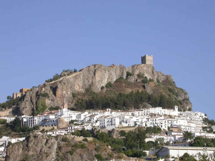 a town on a hill with many buildings on it