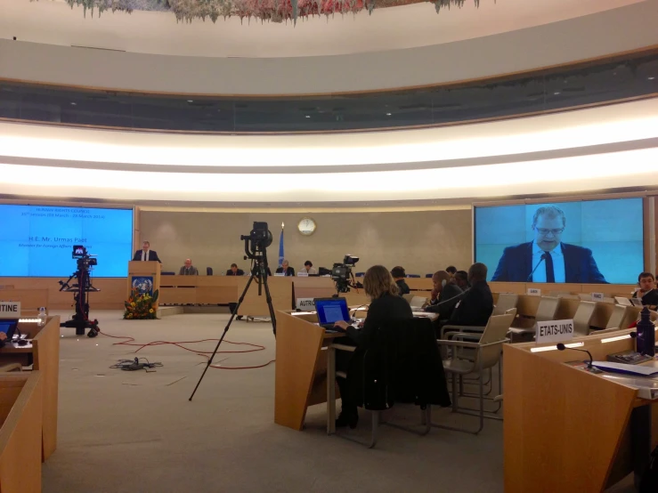 the empty conference room has large screens for people to view