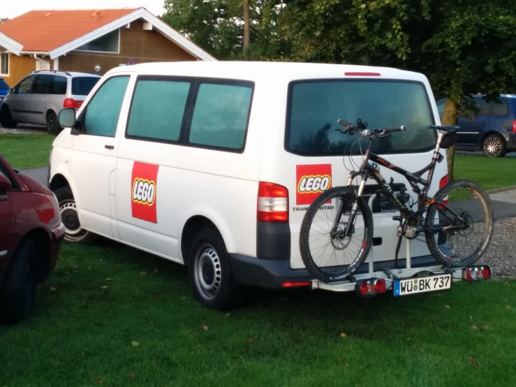 a car is parked with bikes attached to the back