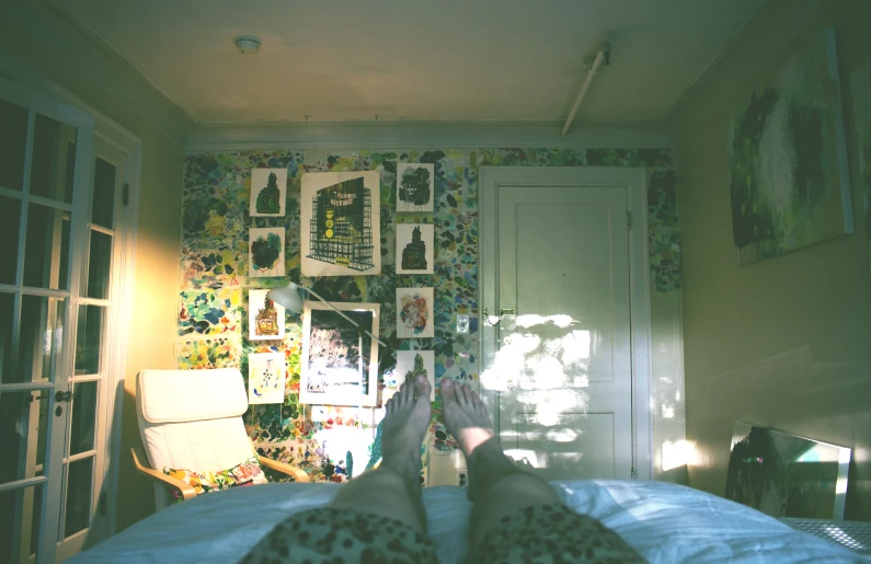 an image of a bedroom setting with sunlight coming in through the windows