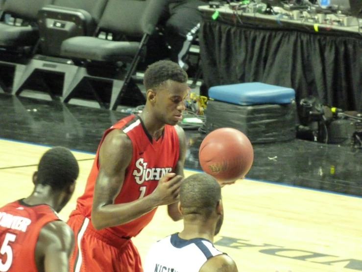 a basketball player about to throw a ball at his opponents