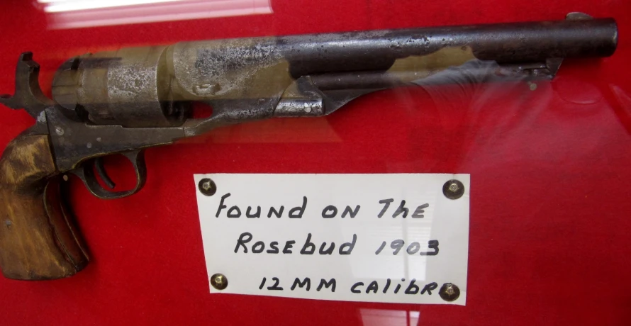 a revolver of some sort is on display