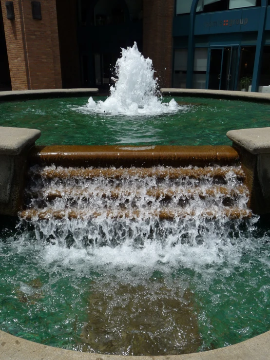 a fountain that has water shooting into the air