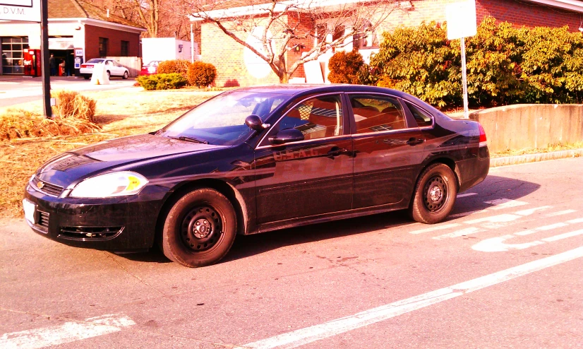 a parked car is parked in front of a house