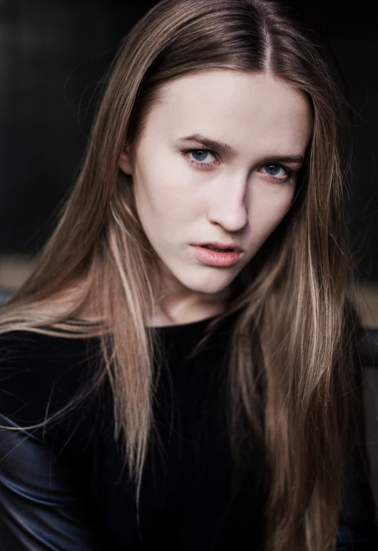 a close up of a person with long hair