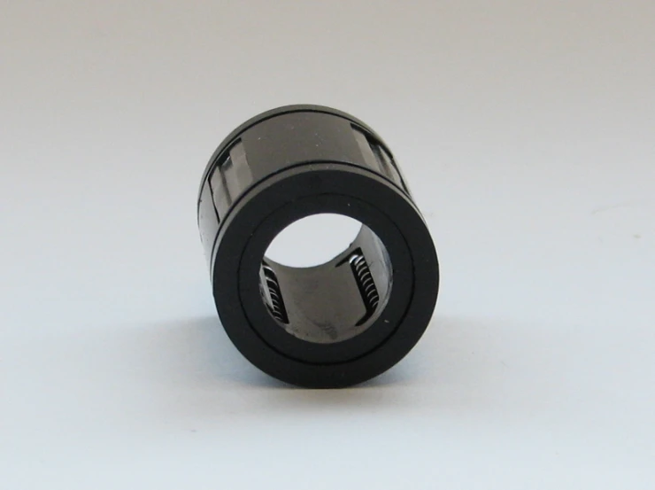 the small, cylindrical object has a black ring