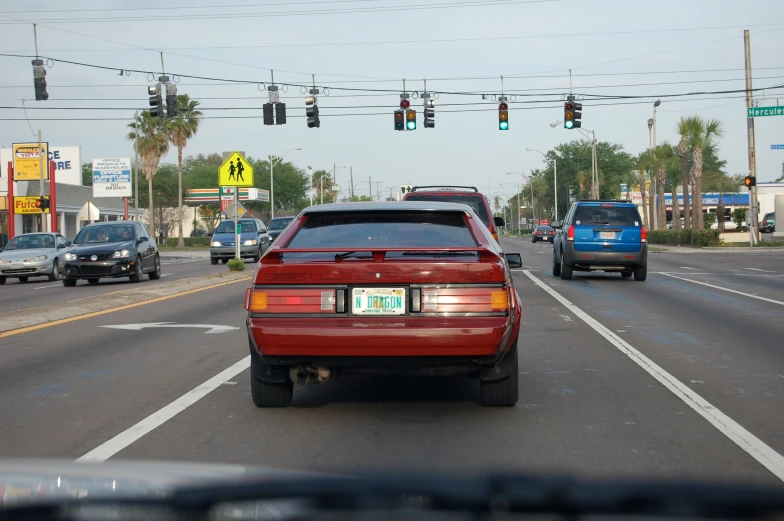 there is an automobile that is driving down the street