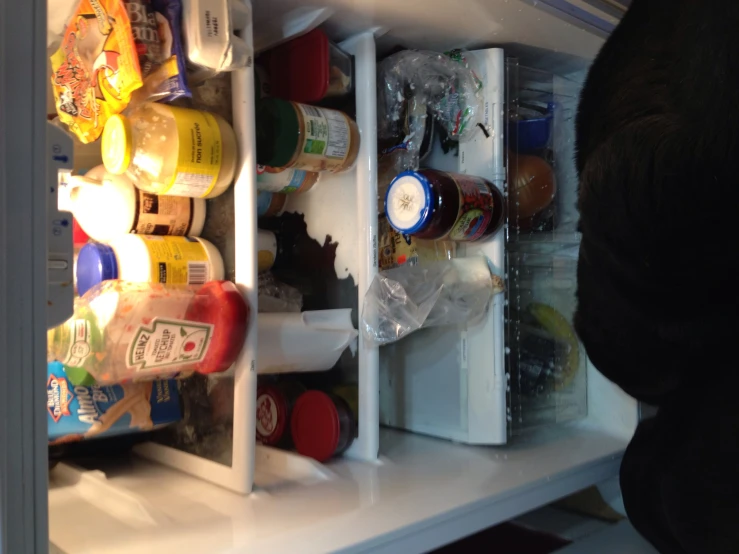 a large open refrigerator filled with food and drinks