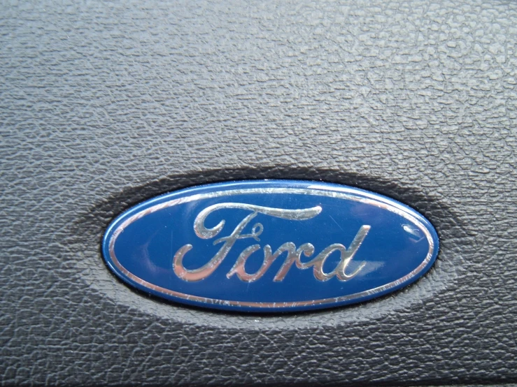there is a blue ford emblem on the dashboard