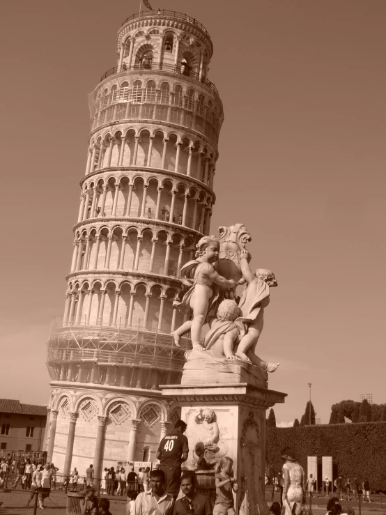 a group of people are outside of a tall building