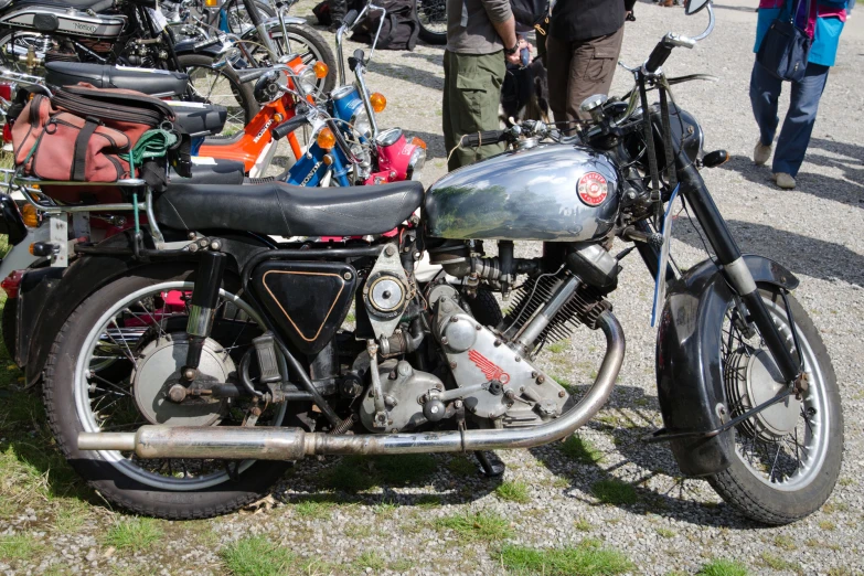 a motorcycle parked in the middle of a grassy field