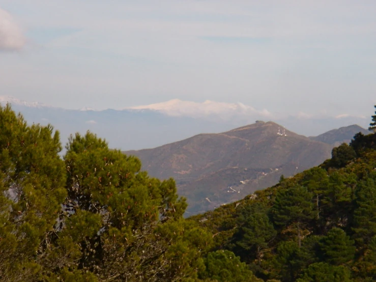 a mountain covered in a white capped area