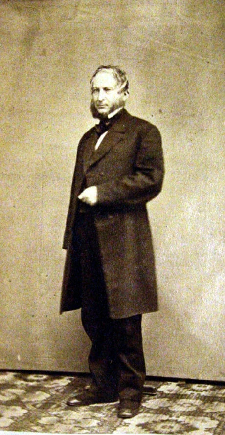 a black and white po of a man in an old fashioned coat