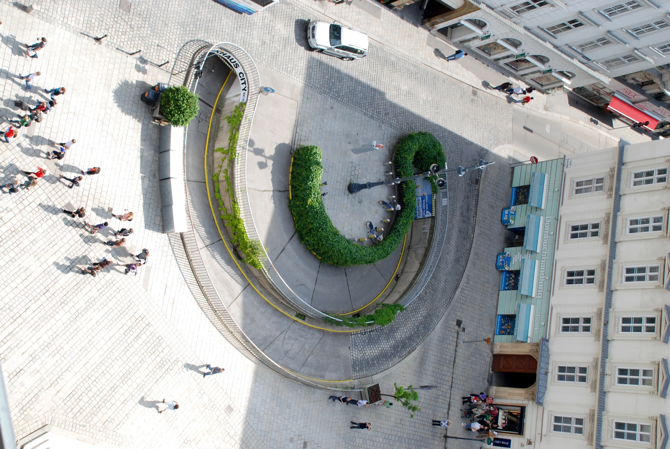 a aerial view shows a spirally - shaped display of greenery and plants