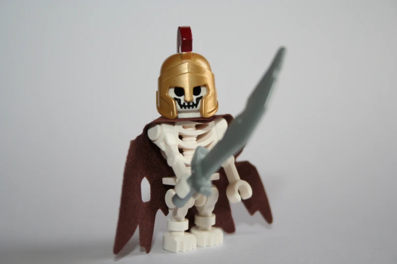 a skeleton in a costume holds a sword