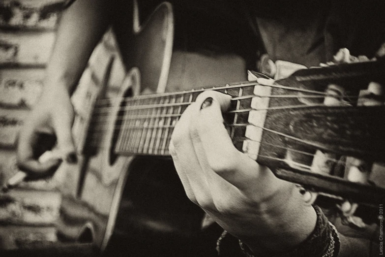 a person playing guitar on the floor