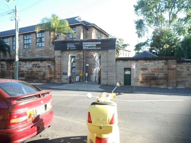 there is a parking lot with two cars parked in front of a building