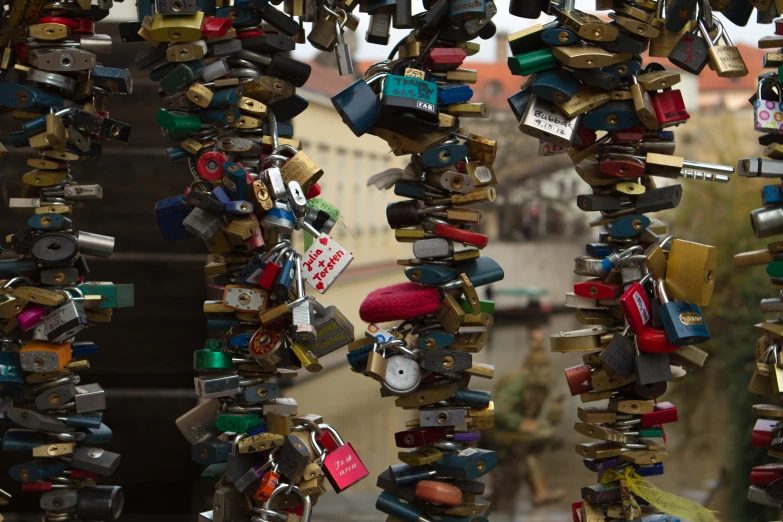 a bunch of keys that are hanging from a wire