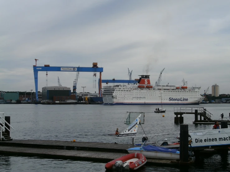 a large cruise ship docked at a dock