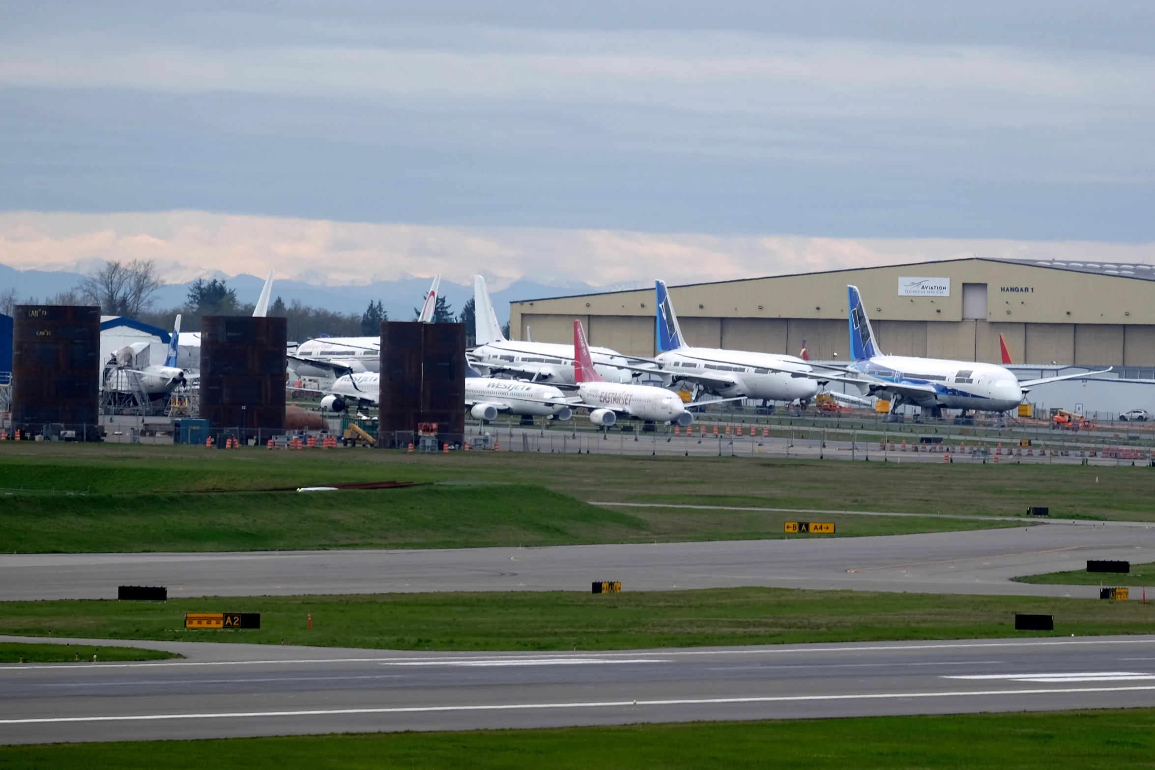 planes are parked on the tarmac at an airport