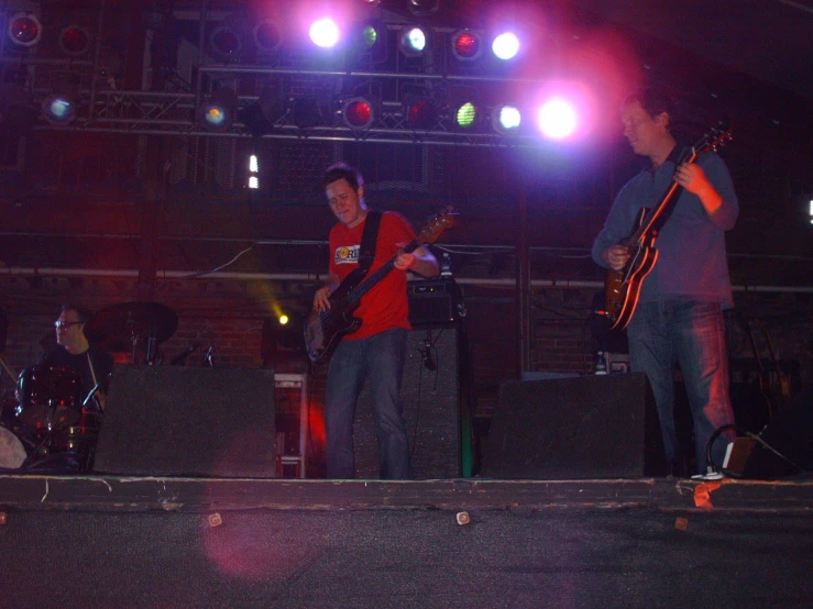 people in a concert at night with musical instruments