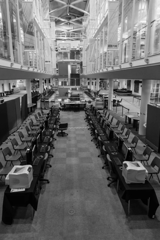 black and white image of computers on the table