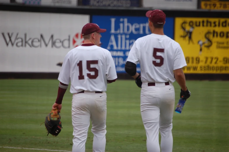 two baseball players standing side by side