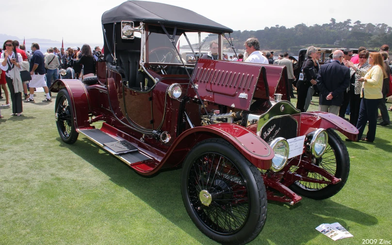 an old classic truck parked at an automobile show