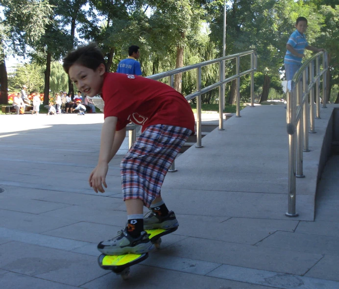 a boy is skateboarding down the stairs on his knees