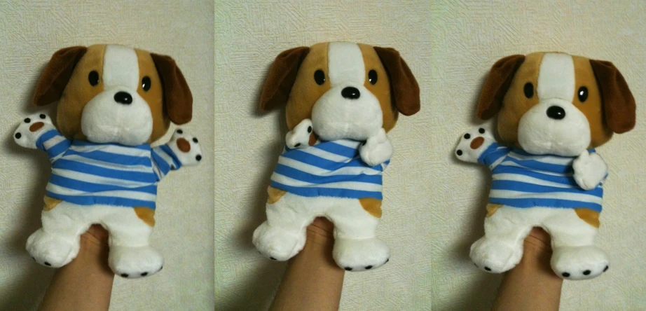 a person is holding two small stuffed dogs