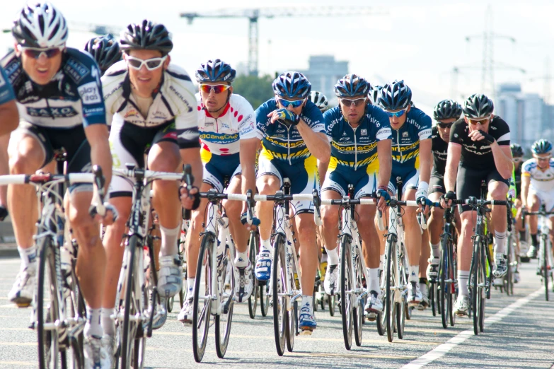 cyclists competing in a race on a roadway