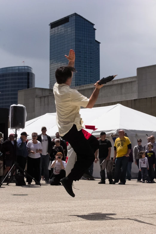 the man is jumping up to catch a frisbee