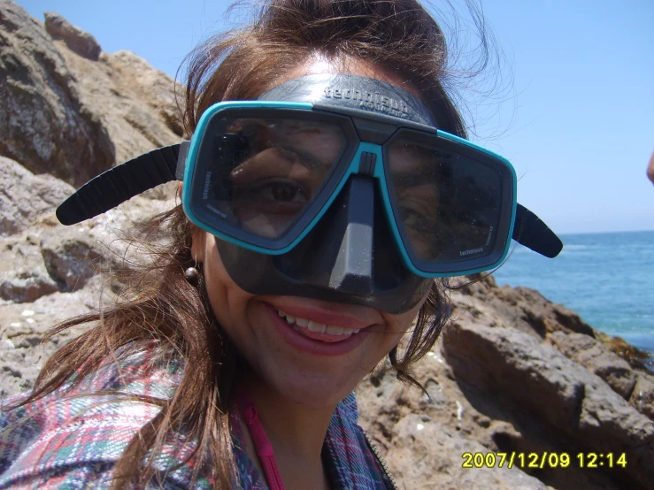 a woman wearing scuba goggles and a mask