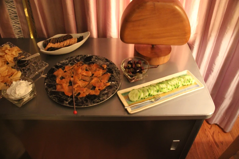 a food set out on a buffet table for a party